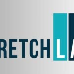 StretchLab Flexologist guiding a client through an assisted stretching session, highlighting StretchLab as the leader in professional stretching services