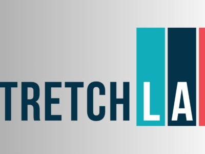 StretchLab Flexologist guiding a client through an assisted stretching session, highlighting StretchLab as the leader in professional stretching services