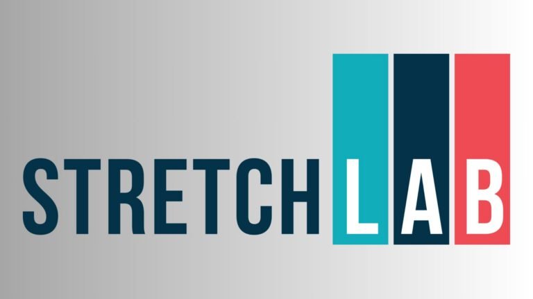 StretchLab Flexologist guiding a client through an assisted stretching session, highlighting StretchLab as the leader in professional stretching services