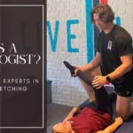 StretchLab Flexologist performing assisted stretching on a client. Learn what a Flexologist is and how they help improve flexibility and mobility
