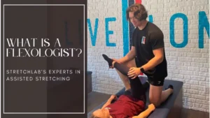 StretchLab Flexologist performing assisted stretching on a client. Learn what a Flexologist is and how they help improve flexibility and mobility