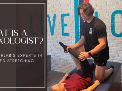 StretchLab Flexologist performing assisted stretching on a client. Learn what a Flexologist is and how they help improve flexibility and mobility
