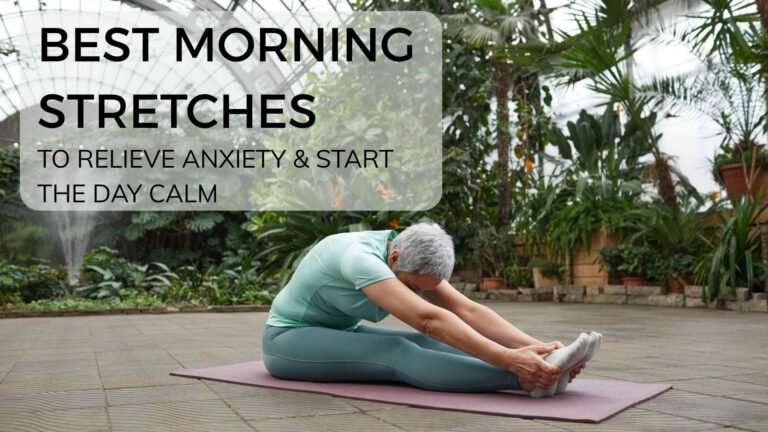 Woman seated cross-legged on a yoga mat in a softly lit morning room, gently stretching her neck with eyes closed—illustrating a calming morning stretch routine designed to reduce anxiety and promote mental clarity.