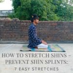 Person performing a kneeling shin stretch on a yoga mat, sitting back on their heels with toes pointed behind them—demonstrating an effective stretch for the anterior tibialis to prevent shin splints and improve flexibility.