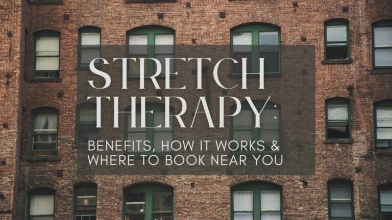 Stretch therapist guiding a client through a leg stretch on a professional table in a wellness studio, illustrating hands-on stretch therapy for improved flexibility, posture, and pain relief.