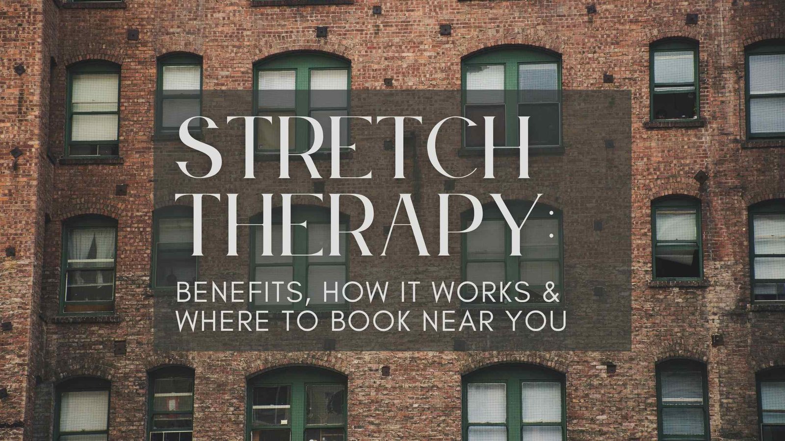 Stretch therapist guiding a client through a leg stretch on a professional table in a wellness studio, illustrating hands-on stretch therapy for improved flexibility, posture, and pain relief.